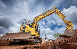 excavator digging a pipe trench