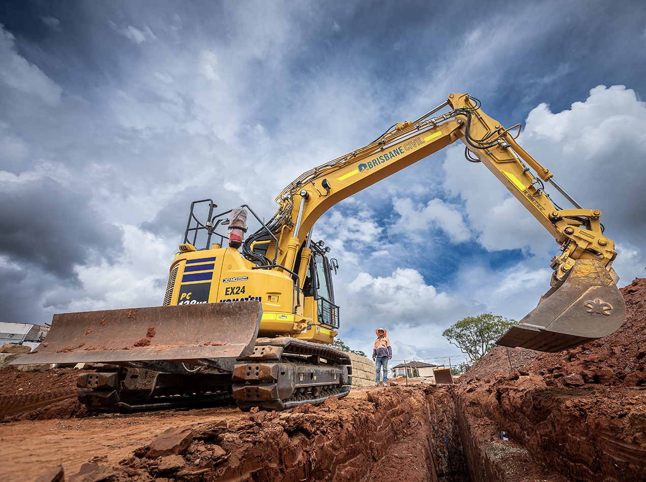 excavator digging a pipe trench